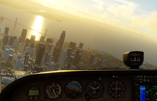 Downtown San Francisco seen in golden sunrise light from an airplane cockpit in X-Plane 12. There is bright sun glare reflected off San Francisco Bay, and the Bay Bridge is prominently visible.