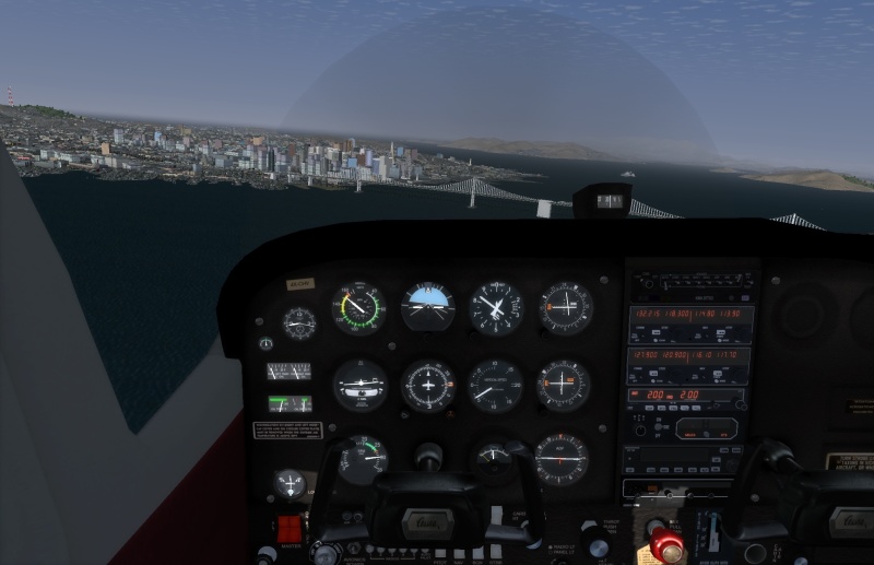 A screenshot from the FlightGear flight simulator, showing a view of San Francisco from the cockpit of a Cessna 172. Geez, I'm way overspeed.
